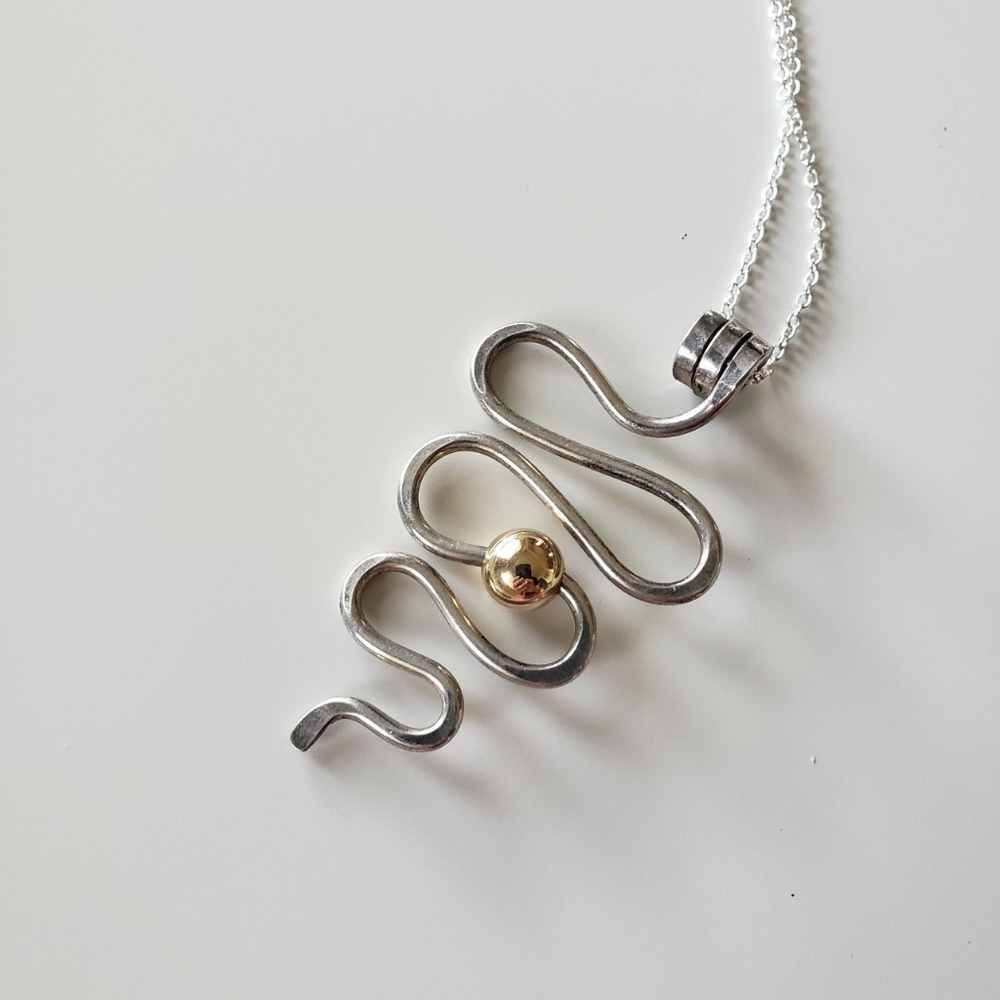 Sterling silver modernist squiggle pendant necklace with gold accent ball